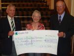 Bob and Marilyn from the Samaritans happy to receive a BIG cheque from Colin (Cambridge South Club).